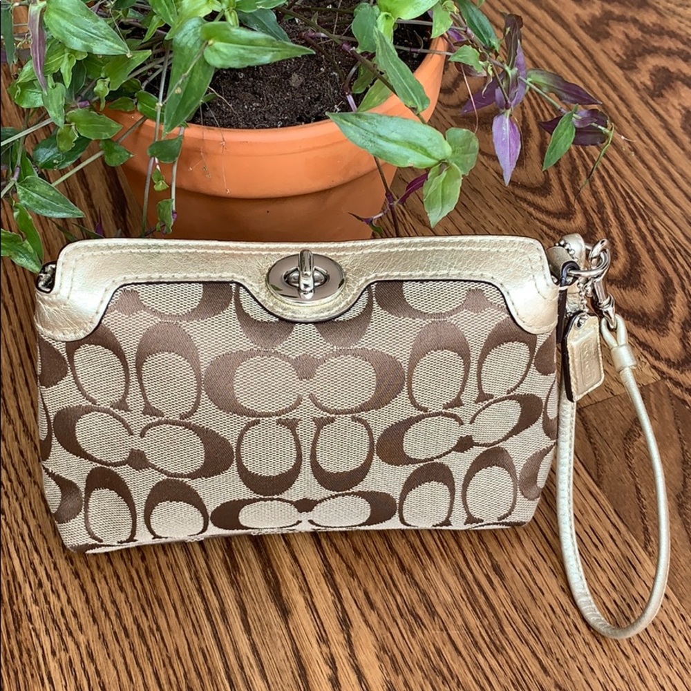 Coach signature print wristlet with gold trim
